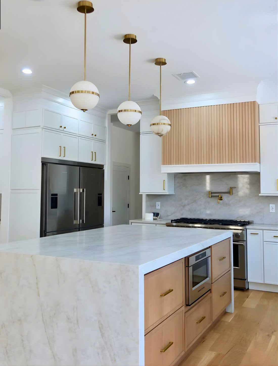 Custom kitchen — white marble and brass