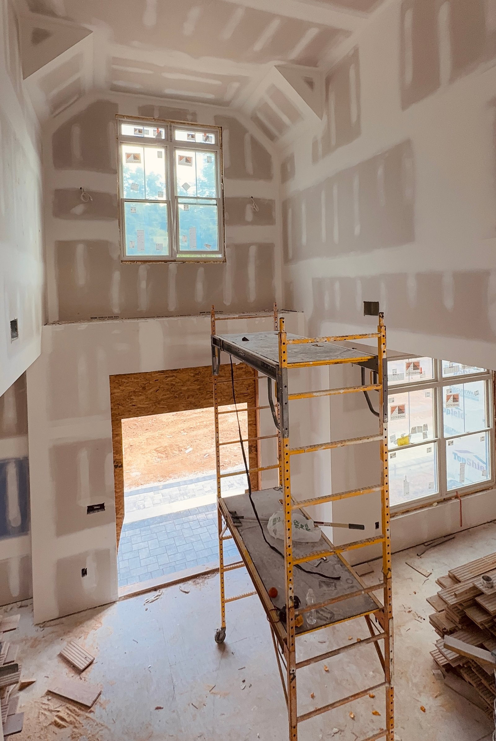 OES Properties build in progress — custom interior framing and drywall